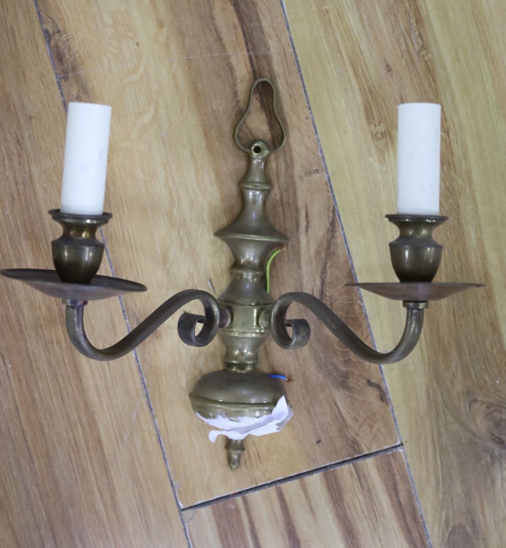 A group of Dutch style brass wall lights and two lanterns